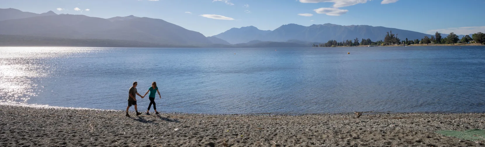 Walking along Lake Te Anau lakefront in Southland New Zealand