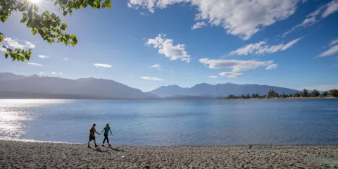 Walking along Lake Te Anau lakefront in Southland New Zealand