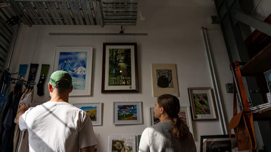 Couple browsing local art at Fenton Street Art Collective in Stratford, Taranaki