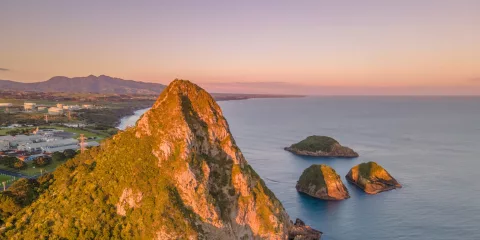 Aerial view of Paritutu Rock and Sugar Loaf Islands at sunrise in New Plymouth: Credit Skyview Photography