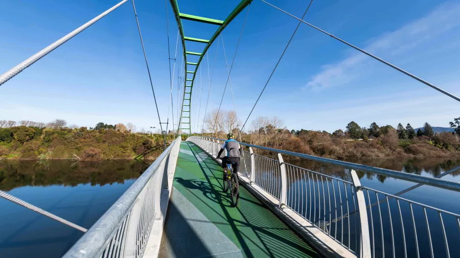 Cyclist crossing Perry Bridge in Horotiu on the Te Awa River Ride near Hamilton