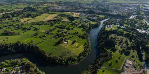 Aerial view of the Waikato River flowing through Hamilton, New Zealand.