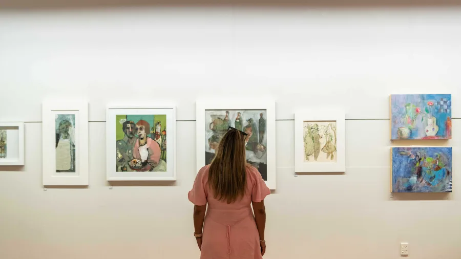 Visitor viewing artwork at Waikato Museum in Hamilton, New Zealand.