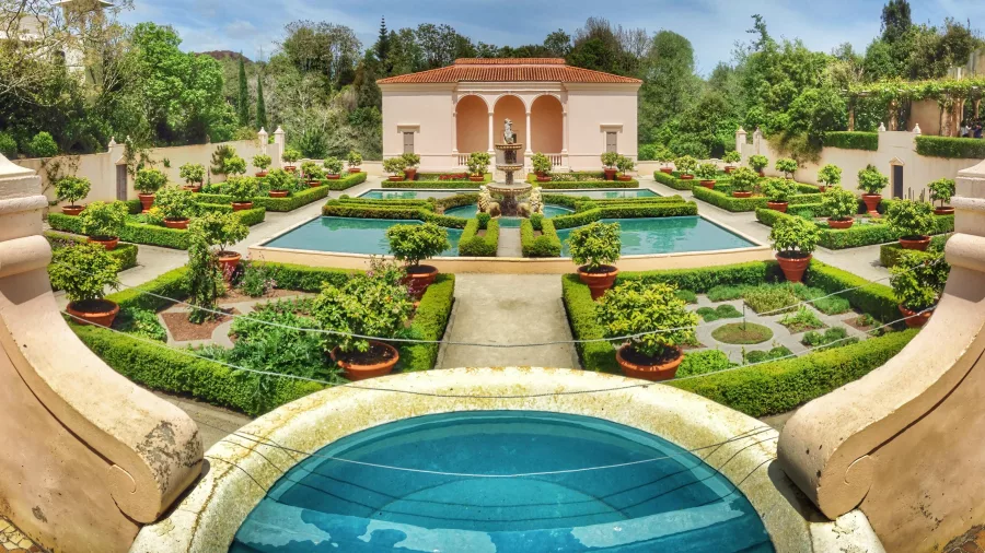 Italian Renaissance Garden with pools, potted citrus trees, and lawn hedges at Hamilton Gardens in New Zealand