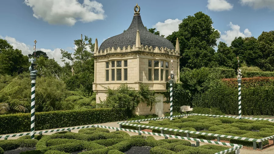 Tudor-style pavilion and manicured hedge maze at Hamilton Gardens, New Zealand