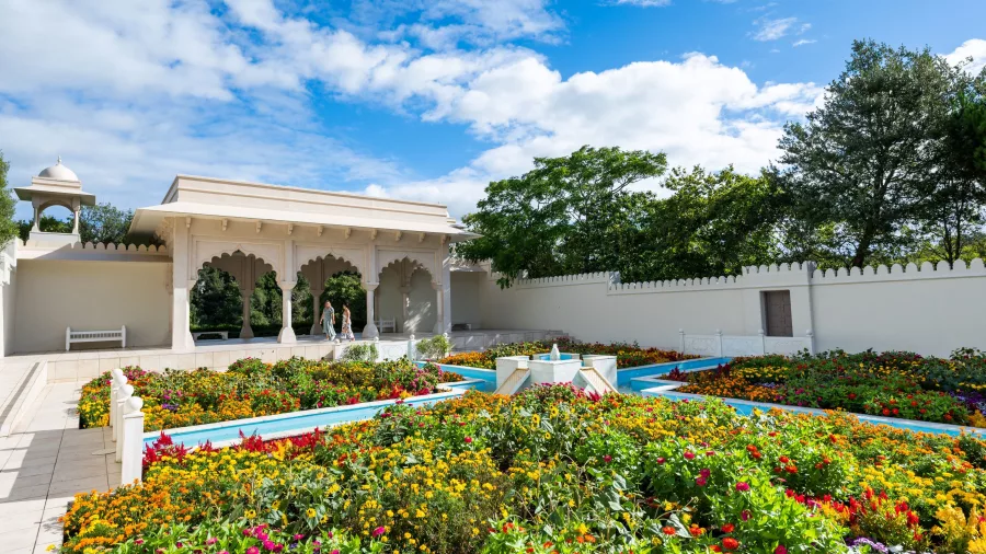 Ornate pavilion and colourful flower beds in the Indian Char Bagh Garden at Hamilton Gardens in Waikato