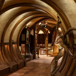 Arched wooden hallway inside a Bagshot Row Hobbit hole at Hobbiton Movie Set