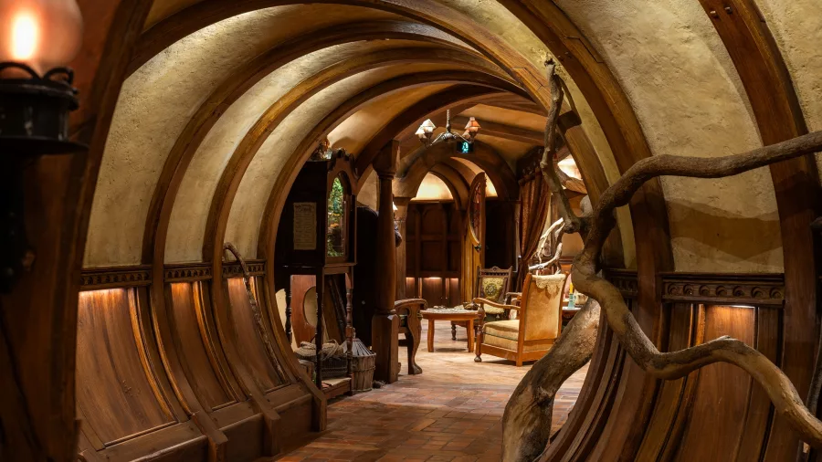 Arched wooden hallway inside a Bagshot Row Hobbit hole at Hobbiton Movie Set