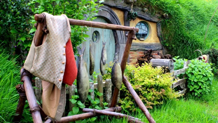 Basket of fresh produce placed outside a colourful hobbit hole at Hobbiton Movie Set