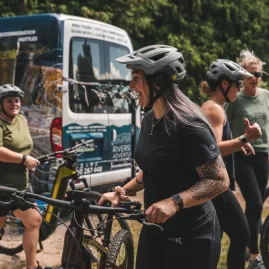 Group of cyclists preparing for a Riverside Adventures tour along the Waikato River Trails