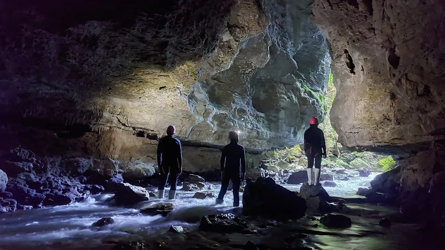 Underground cave exploration with natural light in Waikato