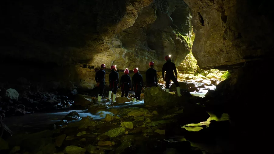Guided cave expedition with light shaft in Waitomo