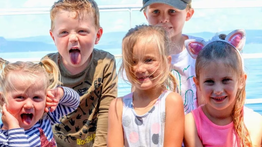 Children smiling and having fun aboard a Lake Taupō cruise