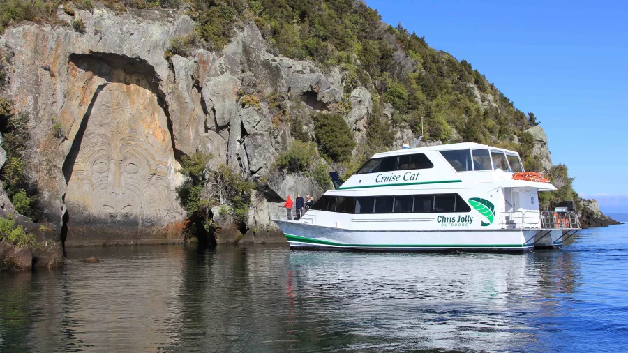 Chris Jolly Outdoors' Cruise Cat viewing the Māori Rock Carvings on Lake Taupō