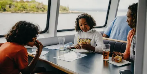 Children doing activities onboard Lake Taupō cruise