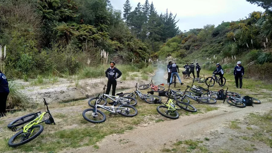 E-bikes parked at a steaming geothermal rest stop on the trail