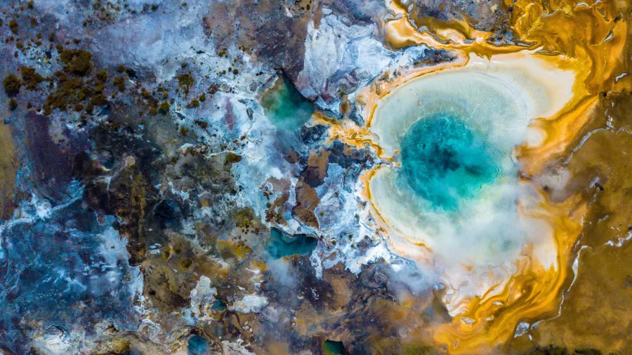 Geothermal pool with blue water and golden silica terraces at Orakei Korako