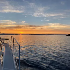 Sunset view from the deck of a cruise boat on Lake Taupō