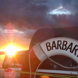 BARBARY life ring with glowing Lake Taupō sunset in the background