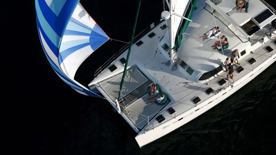 Aerial view of Tiua catamaran with guests relaxing during a morning sail on Lake Taupō