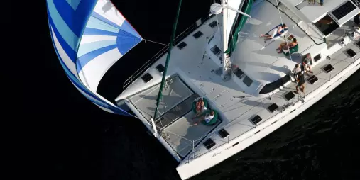 Aerial view of Tiua catamaran with guests relaxing during a morning sail on Lake Taupō