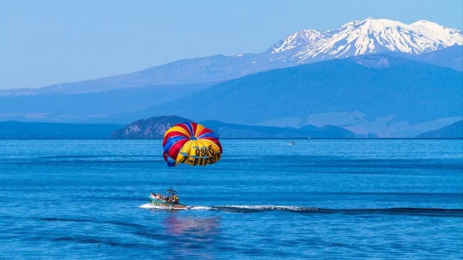 Panoramic view of Lake Taupo with calm waters and distant mountains in New Zealand’s North Island
