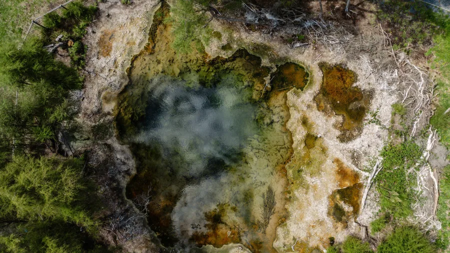 Aerial view of a geothermal pool along the Supervolcanic Cycle Trail in Turangi, New Zealand.