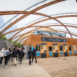 Visitors entering the modern Waitomo Caves Visitor Centre, ready to start their guided tour in New Zealand.