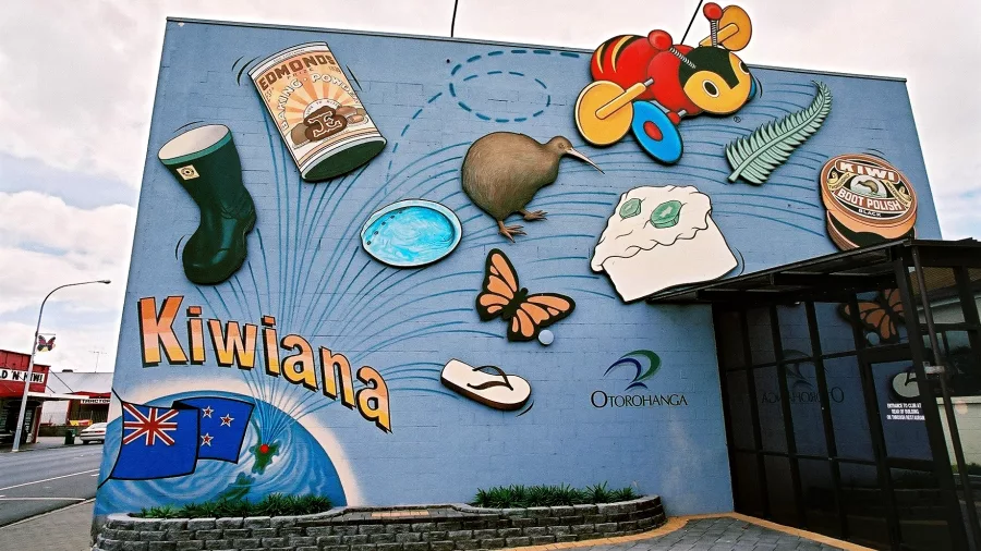 Colourful mural in Otorohanga featuring iconic Kiwiana items such as jandals, pavlova, a buzzy bee, and the Kiwi bird