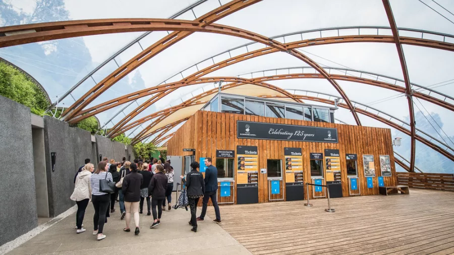 Visitors entering the modern Waitomo Caves Visitor Centre, ready to start their guided tour in New Zealand.