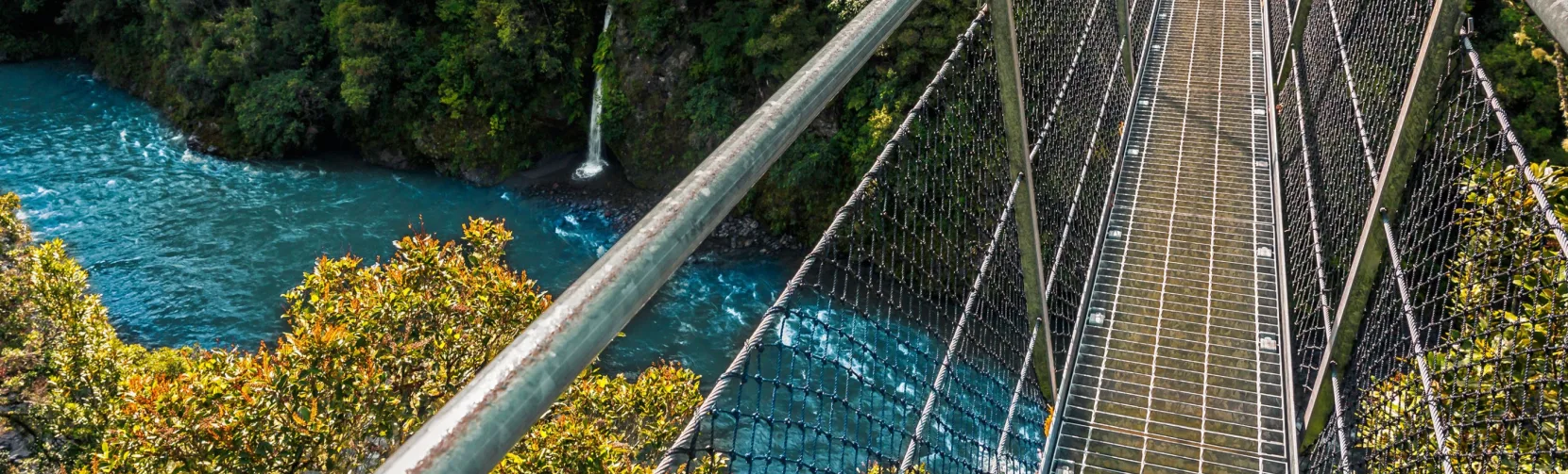 Suspension swing bridge crossing the Waiohine Gorge River in the Wellington Region, New Zealand