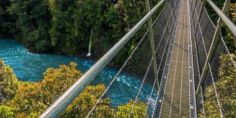 Suspension swing bridge crossing the Waiohine Gorge River in the Wellington Region, New Zealand