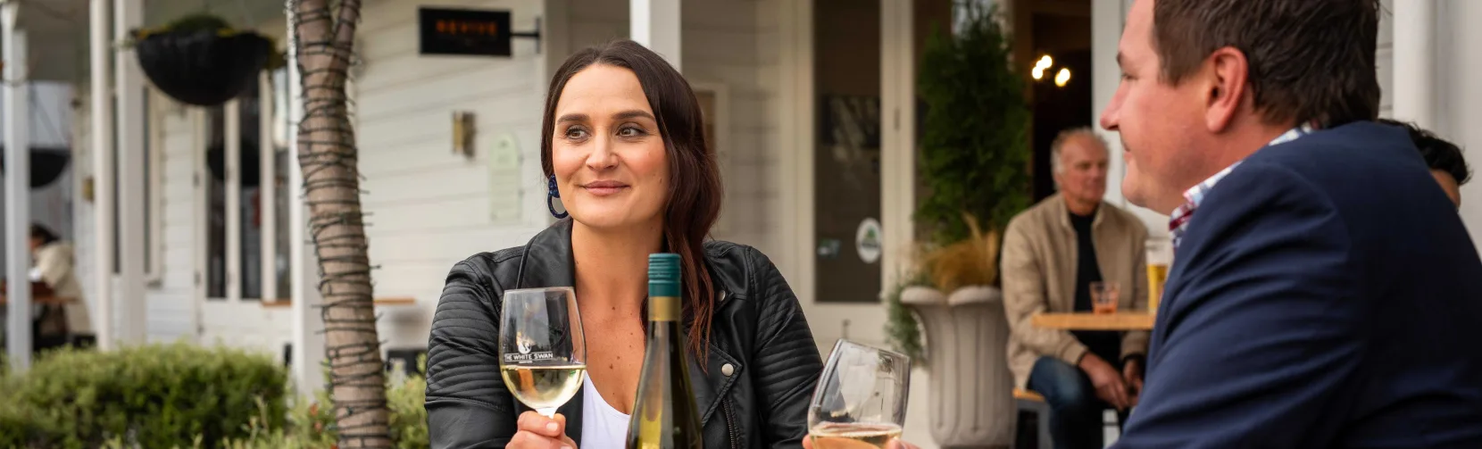 Couple sharing a wine tasting at The White Swan in Greytown