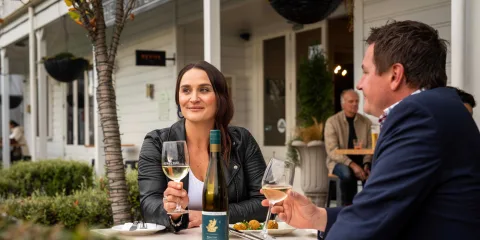 Couple sharing a wine tasting at The White Swan in Greytown