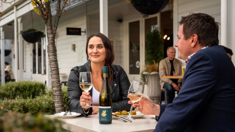 Couple sharing a wine tasting at The White Swan in Greytown