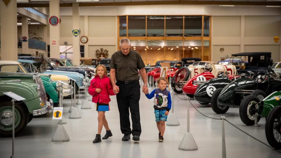 Family walking through the Southward Car Museum on the Kapiti Coast, New Zealand