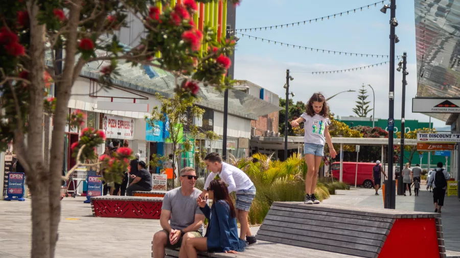 Family enjoying a sunny day at Cobham Court in Porirua City Centre