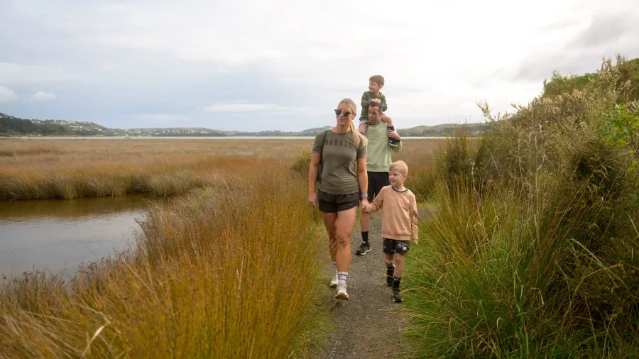 Family walking at Pauatahanui Wildlife Reserve, Porirua