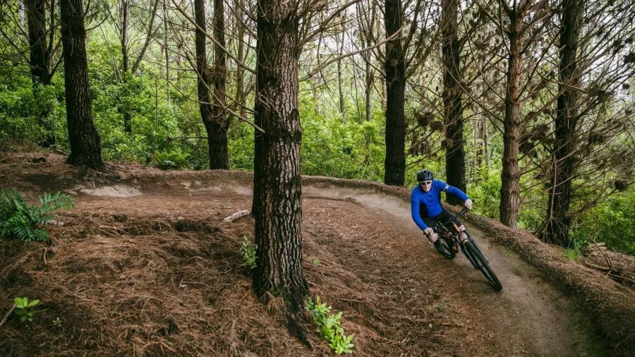 Mountain biker riding downhill trail at Colonial Knob in Porirua