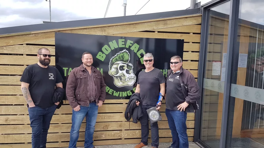 South African supporters posing outside Boneface Brewery on a craft beer tour in Upper Hutt