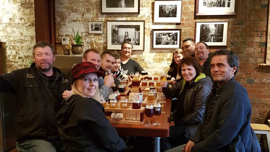Large group enjoying a beer tasting session at Tuatara Third Eye bar in Wellington