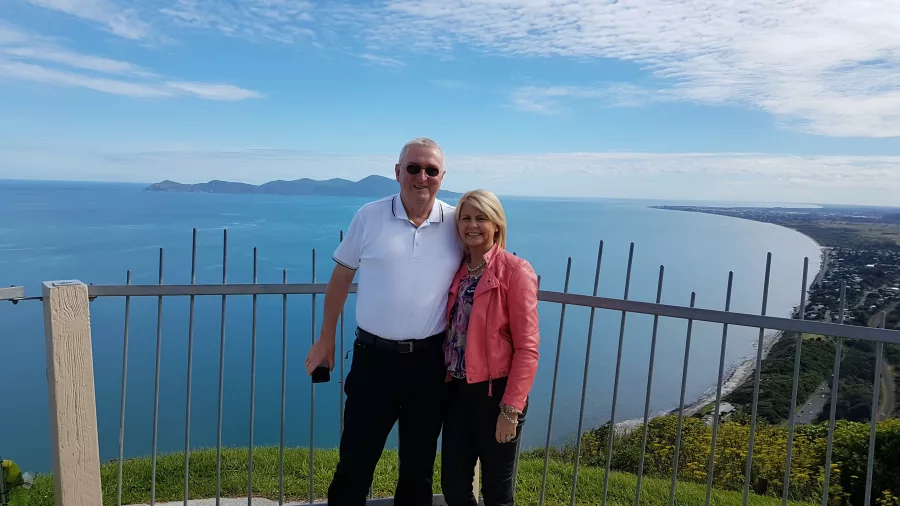 Couple standing at the Paekākāriki Lookout with views of the Kapiti Coast and Kapiti Island