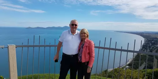 Couple standing at the Paekākāriki Lookout with views of the Kapiti Coast and Kapiti Island