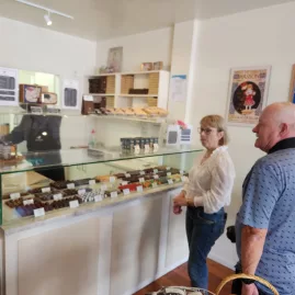 Couple selecting handmade treats at The Chocolate Story in Wellington