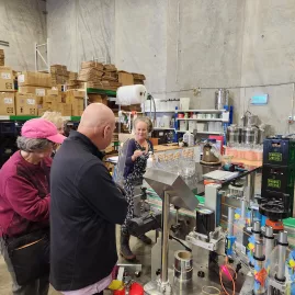 Visitors learning about small-batch spirits at The Bond Store distillery in Wellington
