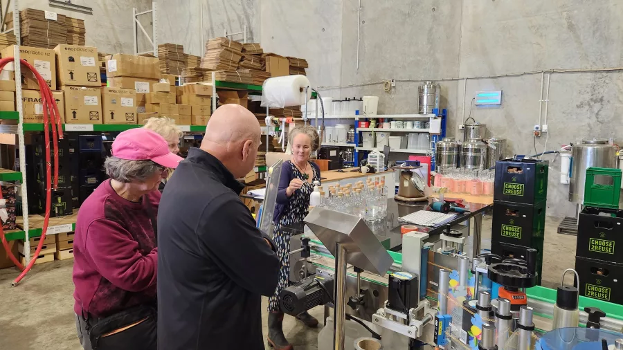 Visitors learning about small-batch spirits at The Bond Store distillery in Wellington