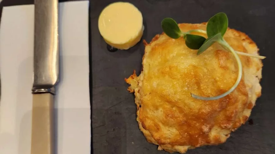 Cheese scone served with butter at a Wellington eatery