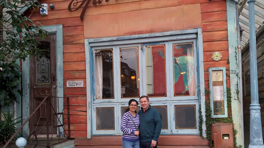 Two people standing in front of Havana Bar in Wellington during a food tour