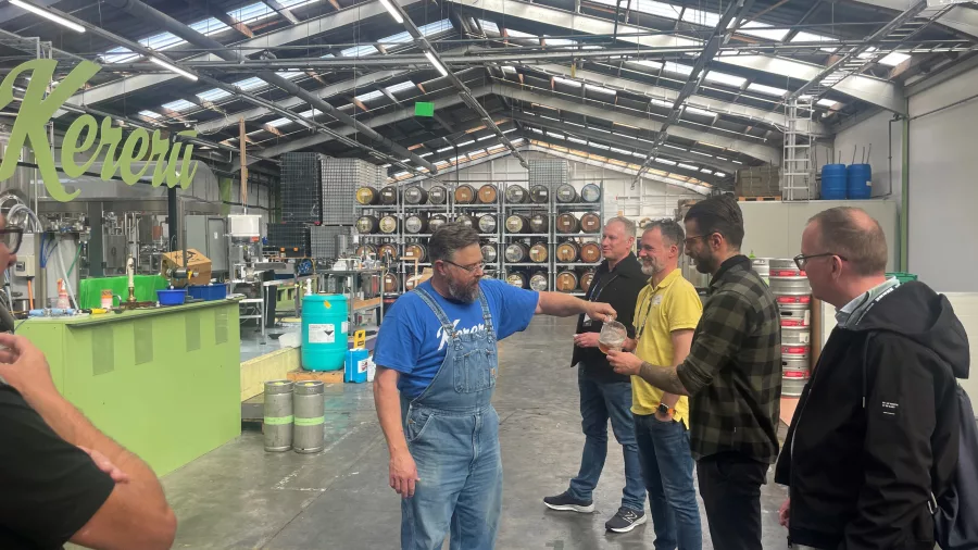 Group learning about beer brewing at Kereru brewery with a guide