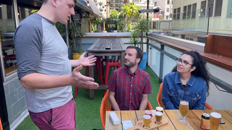Guests enjoying a guided beer tasting session at Fork Brewer’s rooftop in Wellington